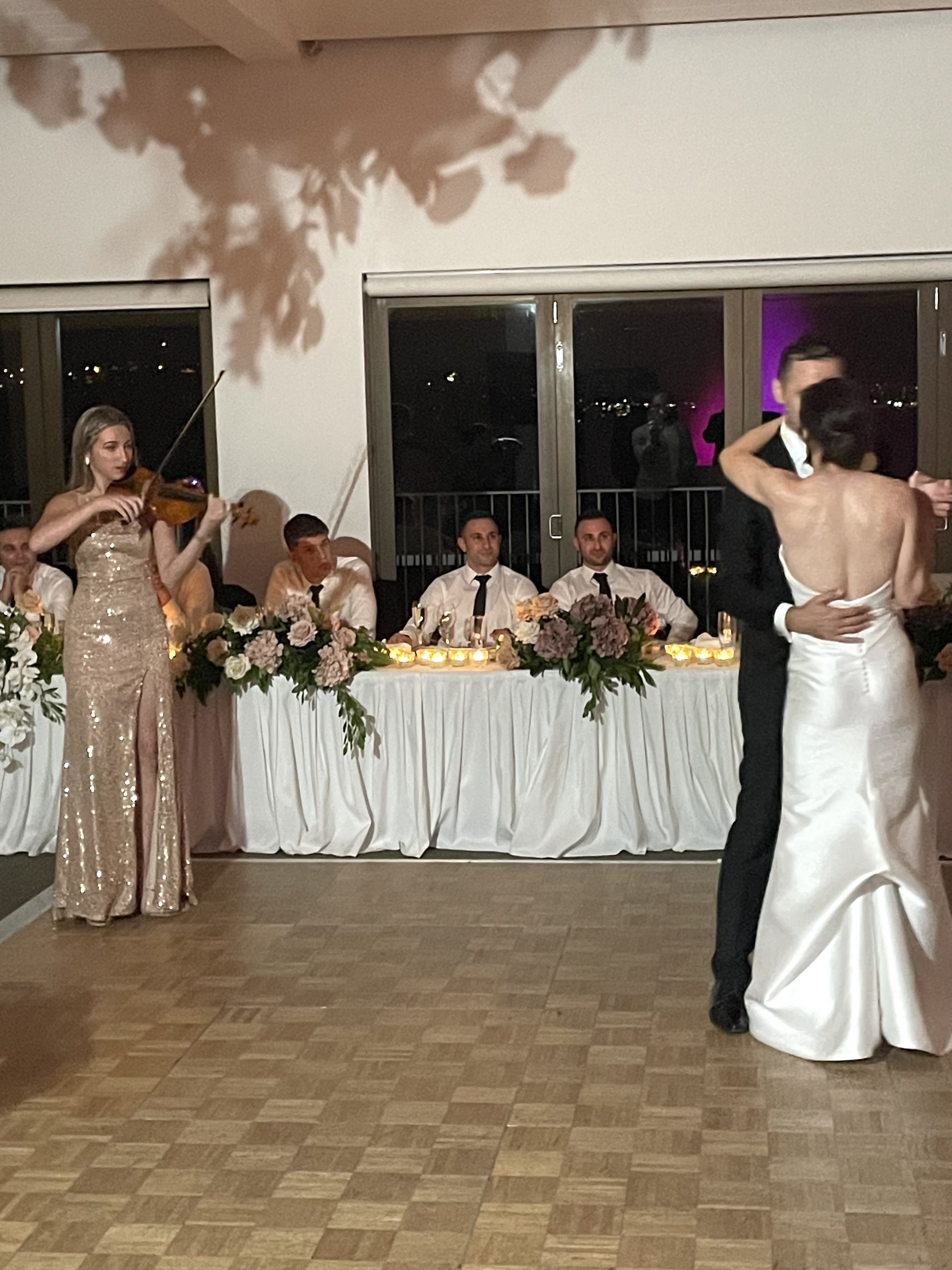 Tali playing violin for bride and groom first dance
